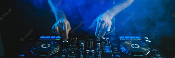 closeup-dj-working-blue-light_181624-18773