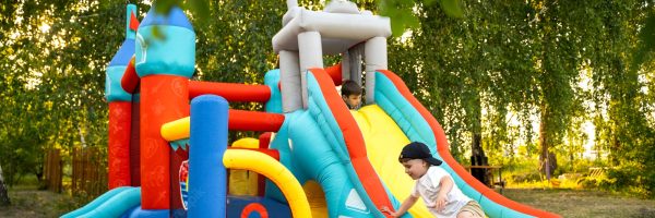 full-shot-kid-playing-bounce-house_23-2149551612