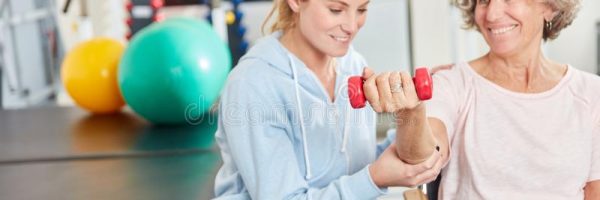 senior-woman-doing-dumbbell-training-rehab-physiotherapist-supports-144676938